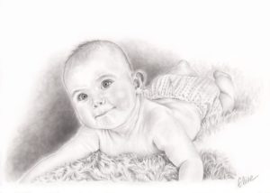 Portrait dessin d'après photo d'un bébé allongé sur une couverture